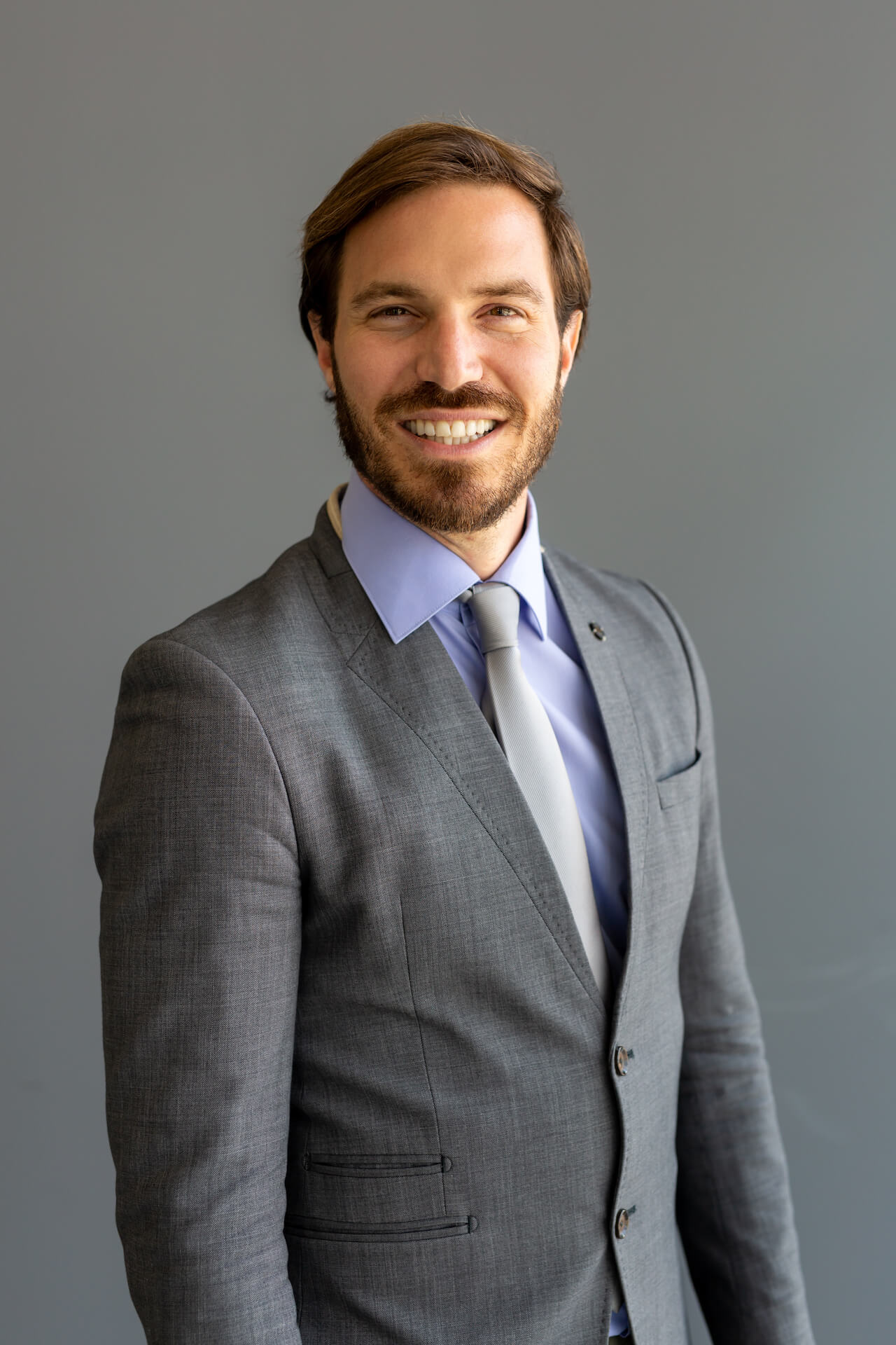 handsome-smiling-confident-businessman-portrait-in-2021-08-30-07-47-24-utc.jpg